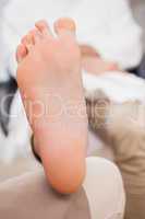 Customer relaxing their foot