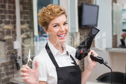 Confident hairdresser smiling at camera