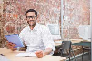 Businessman with paperwork at desk