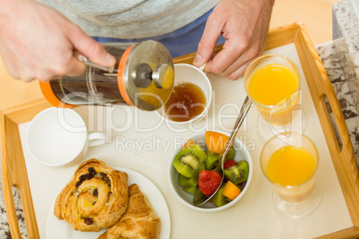 Man preparing a breakfast tray