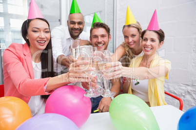 Casual business team toasting with champagne