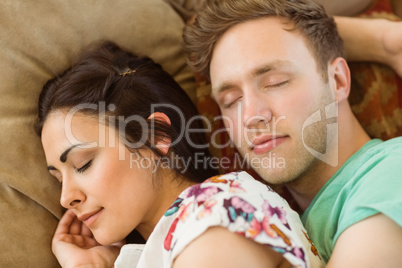 Cute couple cuddling on couch