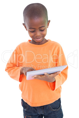 Cute boy using his tablet pc