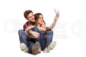 Young couple taking selfie with smart phone