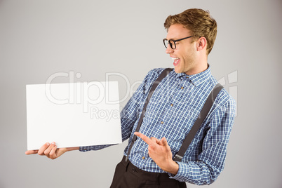 Geeky hipster showing a card Geeky hipster showing a card