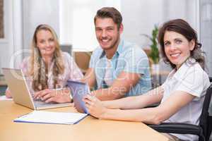 Business people using digital tablet and laptop in meeting