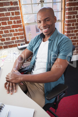 Casual businessman smiling at camera