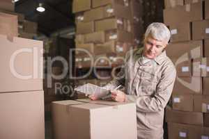 Warehouse worker with clipboard