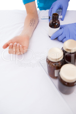 Doctor doing skin prick test at his patient