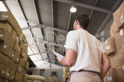 Warehouse worker with clipboard