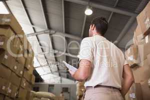 Warehouse worker with clipboard