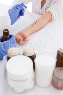 Doctor doing skin prick test at his patient