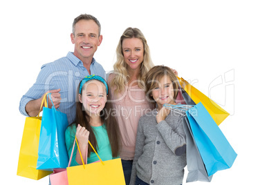 Portrait of smiling family with shopping bag