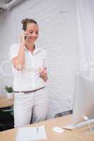 Businesswoman using mobile phone in office