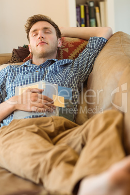 Young man napping on his couch