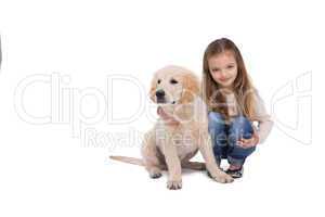 Girl holding her puppy close