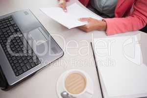 Casual businesswoman working at her desk