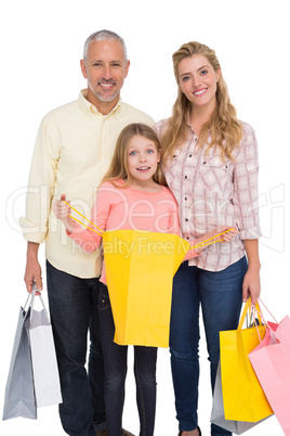 Parents and daughter with shopping bags