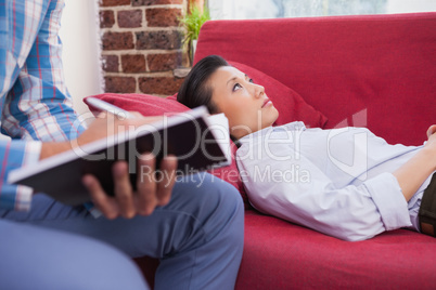 Depressed patient lying on couch