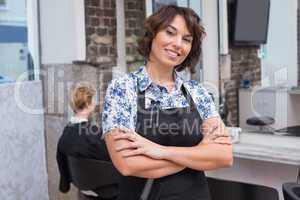 Confident hairdresser smiling at camera