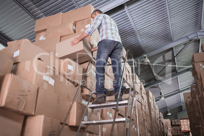 Warehouse worker loading up pallet