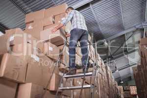 Warehouse worker loading up pallet