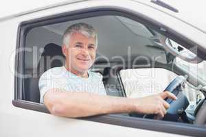 Smiling man driving van