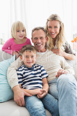 Portrait of a cheerful family on the couche