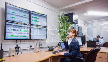 Technician sitting in office running diagnostics