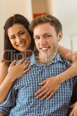 Happy young couple relaxing on the couch