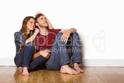 Young couple sitting on floor