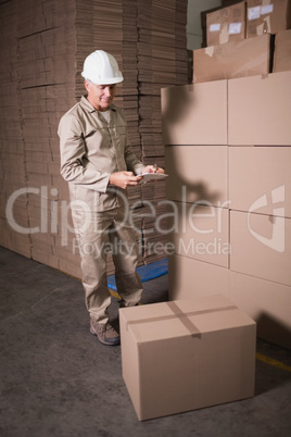 Warehouse worker with clipboard