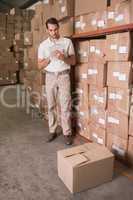 Warehouse worker with clipboard