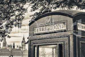 Traditional telephone booth along river Thames, Westminster Pala
