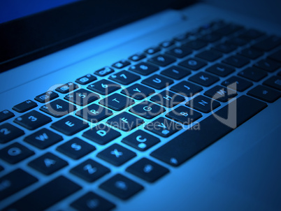 white laptop keyboard with black keys closeup