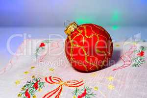 Red Christmas ball on a napkin