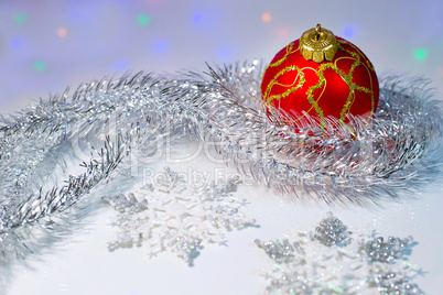 Christmas ball, tinsel and snowflakes