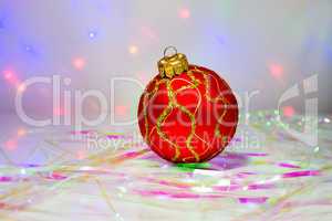 Red Christmas ball on the table