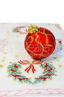 Red Christmas ball embroidered napkin isolated