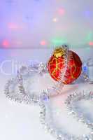 Red Christmas-tree ball and tinsel