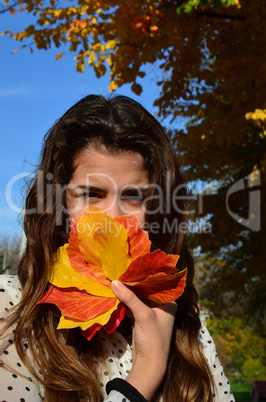Girl and autumn leaves
