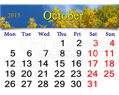 calendar for October of 2015 with autumn leaves and sky