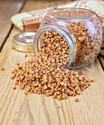 Buckwheat in glass jar on board