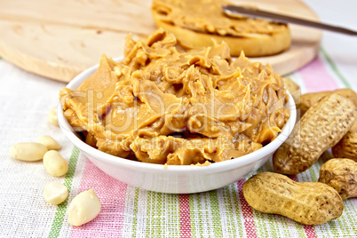 Butter peanut in the bowl on tablecloth