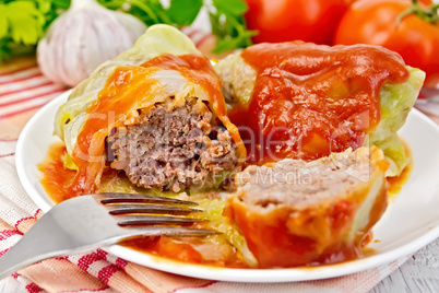 Cabbage stuffed with tomato sauce on light board