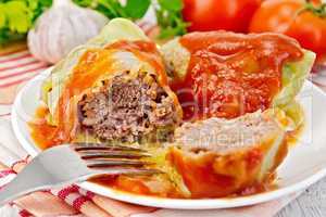 Cabbage stuffed with tomato sauce on light board