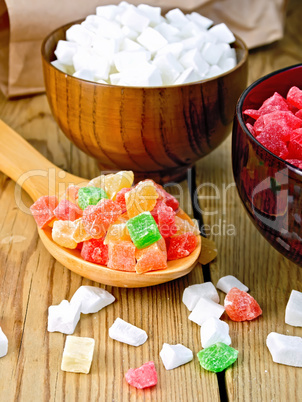 Candied fruit colored in spoon on board