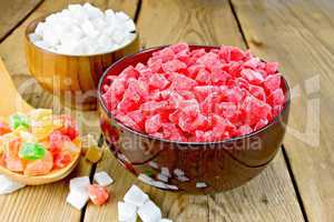 Candied red and white in bowl on board