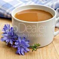 Chicory drink in white cup on board