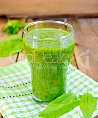 Cocktail with spinach on napkin and board